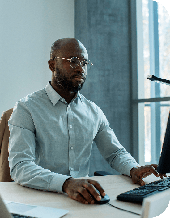 A professional working on a computer