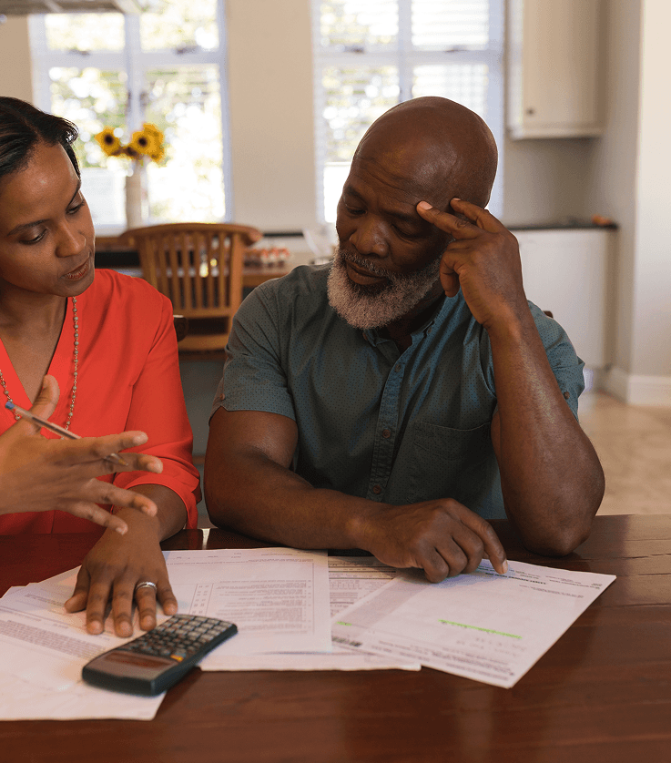 Senior couple discussing in their home